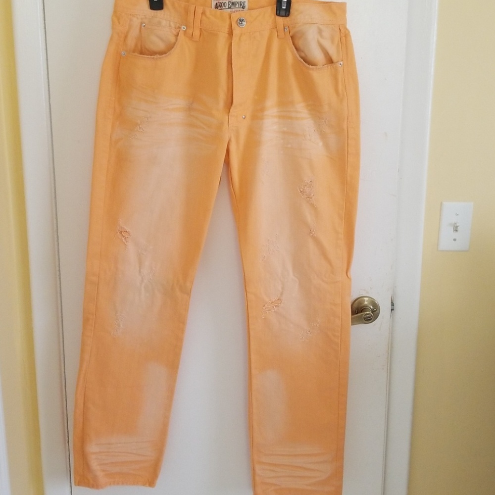 Orange Akoo distressed jeans